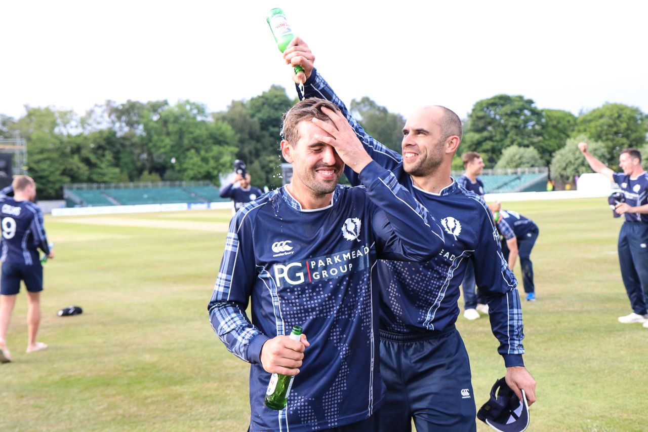 Captain Kyle Coetzer gives Calum MacLeod a well deserved victory shower, Scotland v England, only ODI, Edinburgh, June 10, 2018