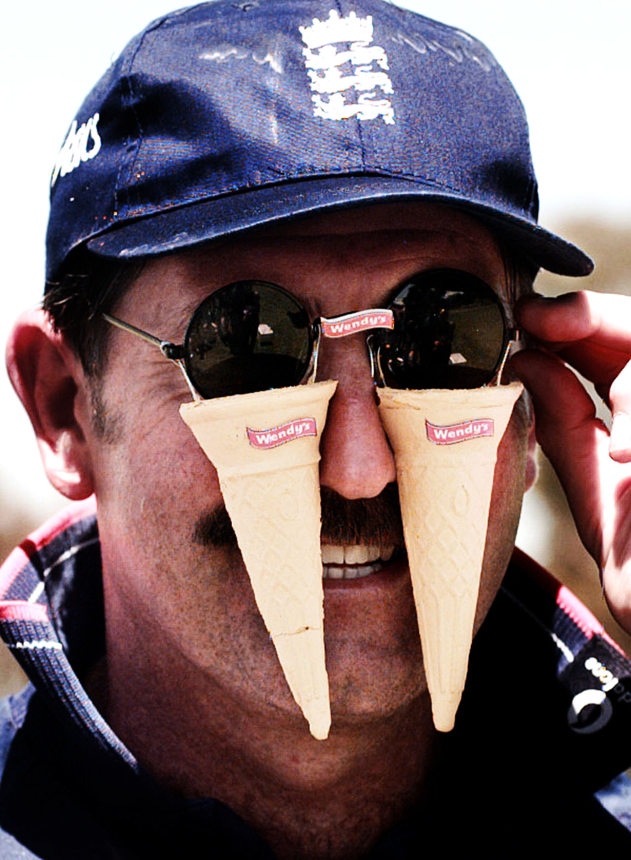 Graham Gooch wears a pair of joke sunglasses with ice-cream cones attached to it, Adelaide, November 6, 1998