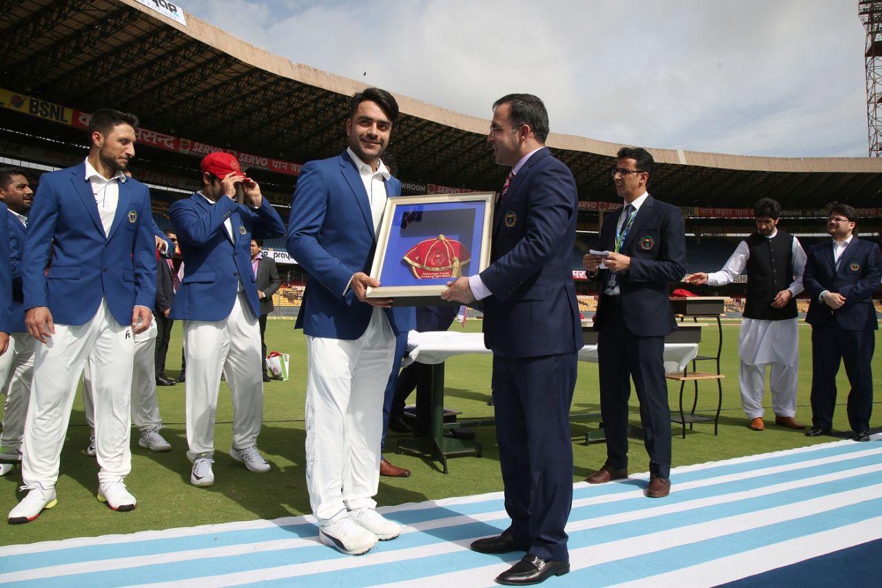 Rashid Khan and his team-mates were presented commemorative caps, India v Afghanistan, Only Test, Bengaluru, 1st day