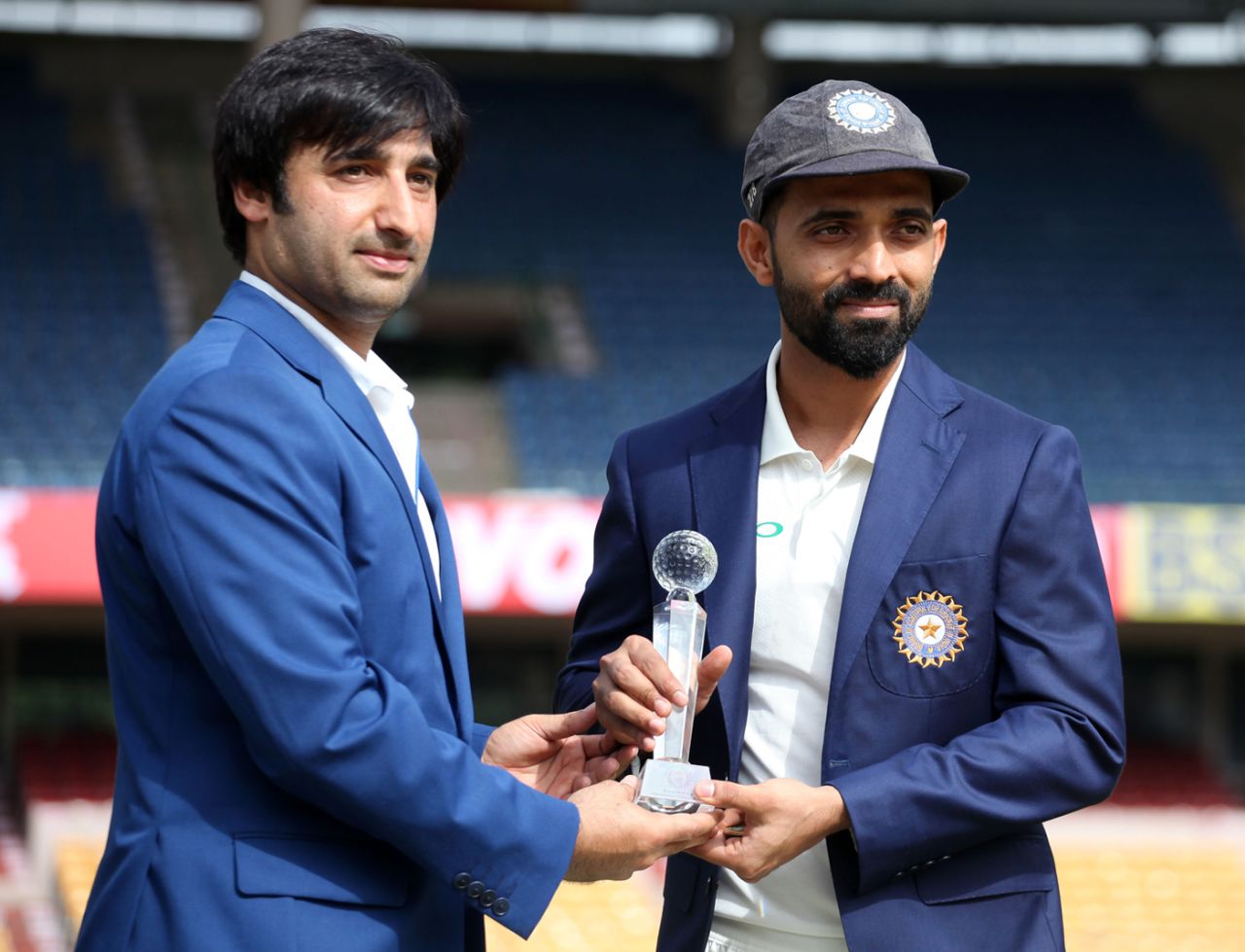 Asghar Stanikzai and Ajinkya Rahane pose with the trophy, India v Afghanistan, Only Test, Bengaluru, 1st day, June 14, 2018