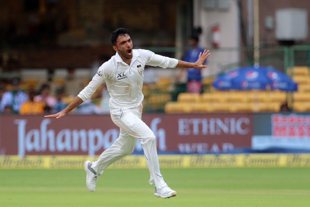 Yamin Ahmadzai takes flight after dismissing KL Rahul, India v Afghanistan, Only Test, Bengaluru, 1st day, June 14, 2018 