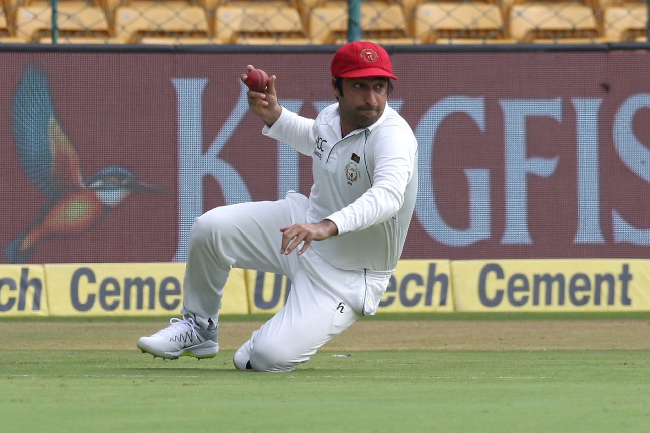 Asghar Stanikzai recovers from a tumbling stop, India v Afghanistan, only Test, Bengaluru, 2nd day, June 15, 2018