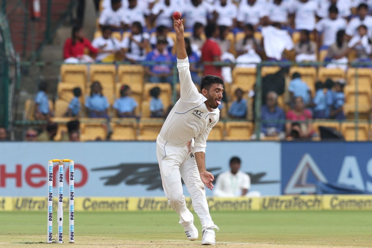 Yamin Ahmadzai is a picture of exertion as he delivers the ball, India v Afghanistan, only Test, Bengaluru, 2nd day, June 15, 2018