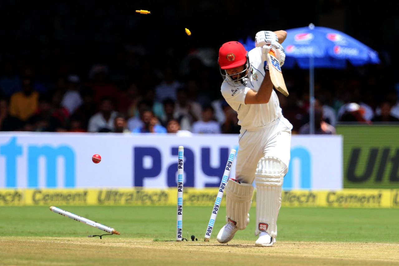 Afsar Zazai loses his stumps to an Ishant Sharma beauty. India v Afghanistan, Only Test, Bengaluru, 2nd day, June 15, 2018