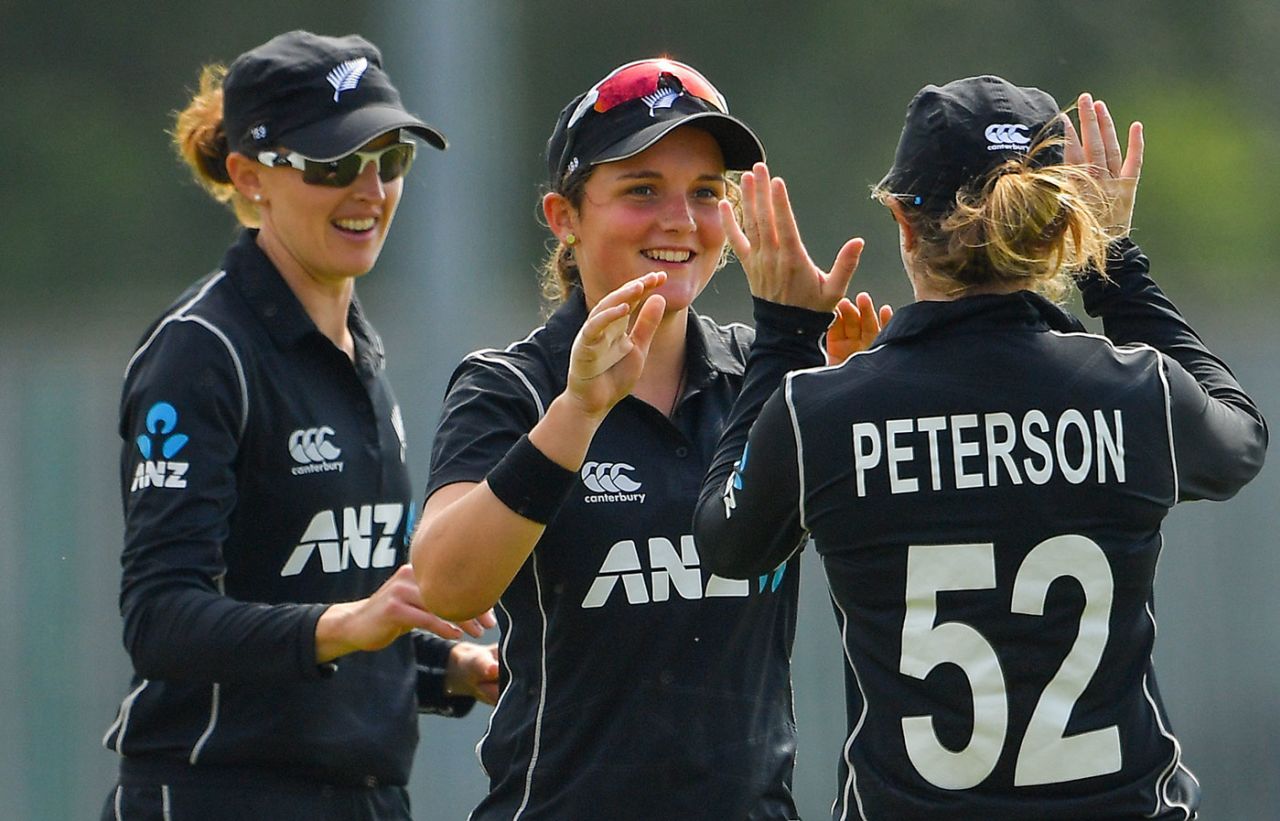 Amelia Kerr celebrates with her team-mates