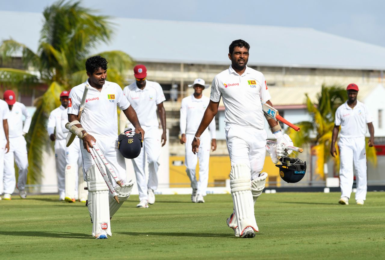 Kusal Perera and Dilruwan Perera troop off the field after steering Sri Lanka to victory, West Indies v Sri Lanka, 3rd Test, Barbados, 5th day, June 26, 2018