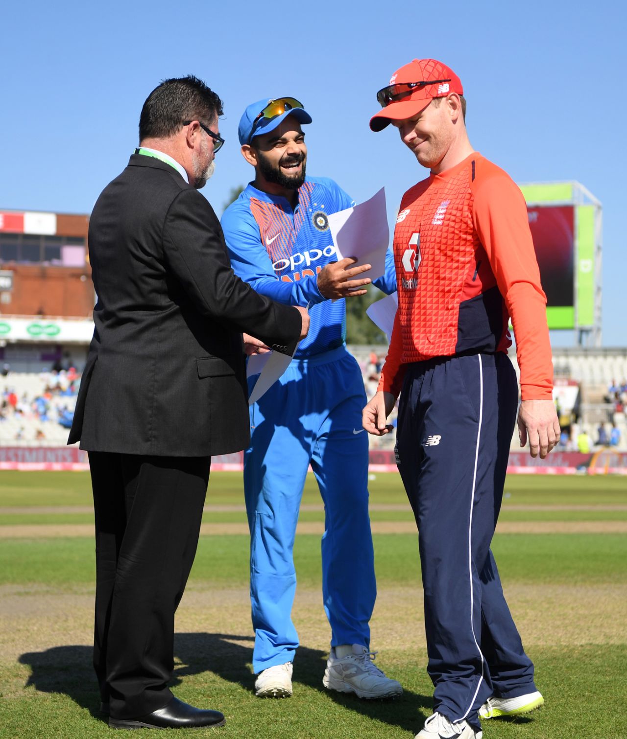 Virat Kohli and Eoin Morgan share a laugh at the toss, England v India, 1st T20I, Manchester, July 3, 2018