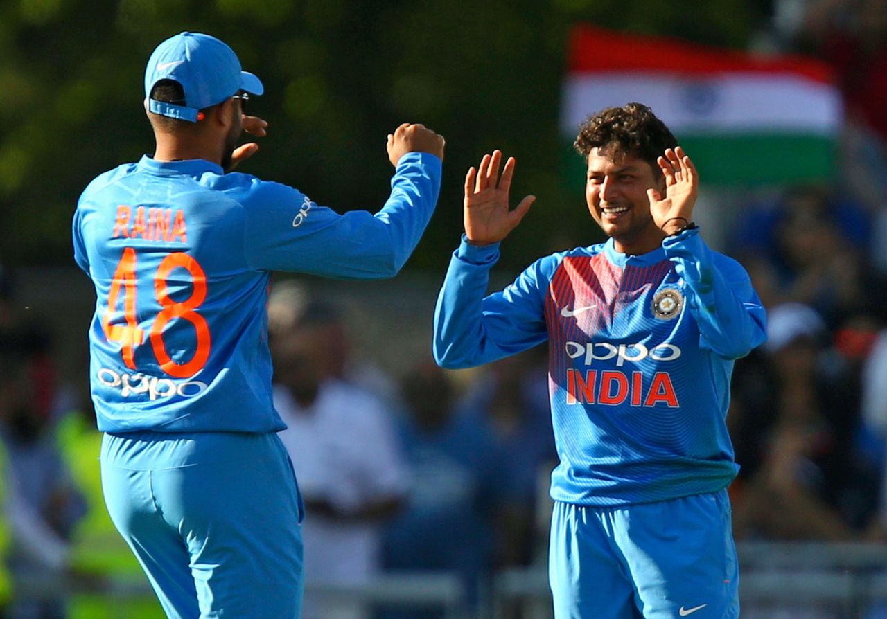 Kuldeep Yadav gets a high-five from Suresh Raina upon picking a wicket, England v India, 1st T20I, Manchester, July 3, 2018