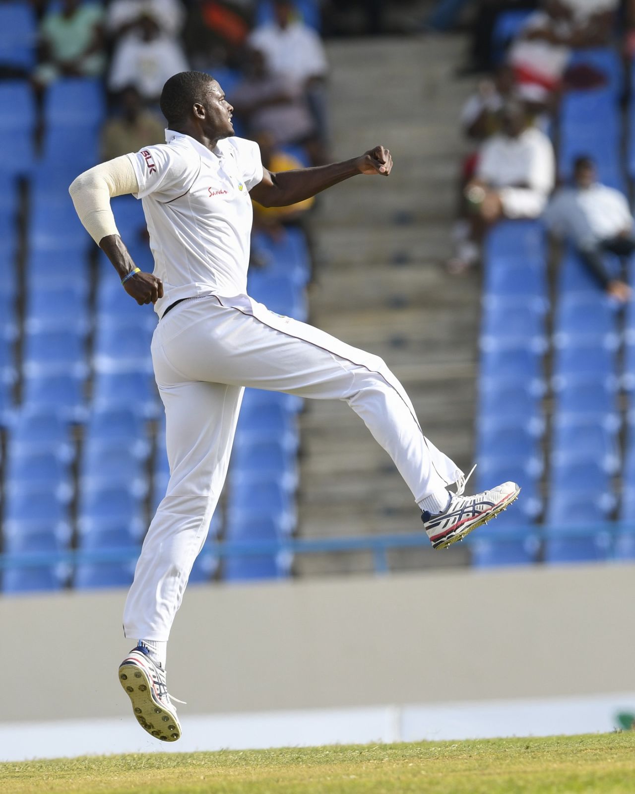 Jason Holder leaps to celebrate a wicket, West Indies v Bangladesh, 1st Test, North Sound, 2nd day, July 5, 2018