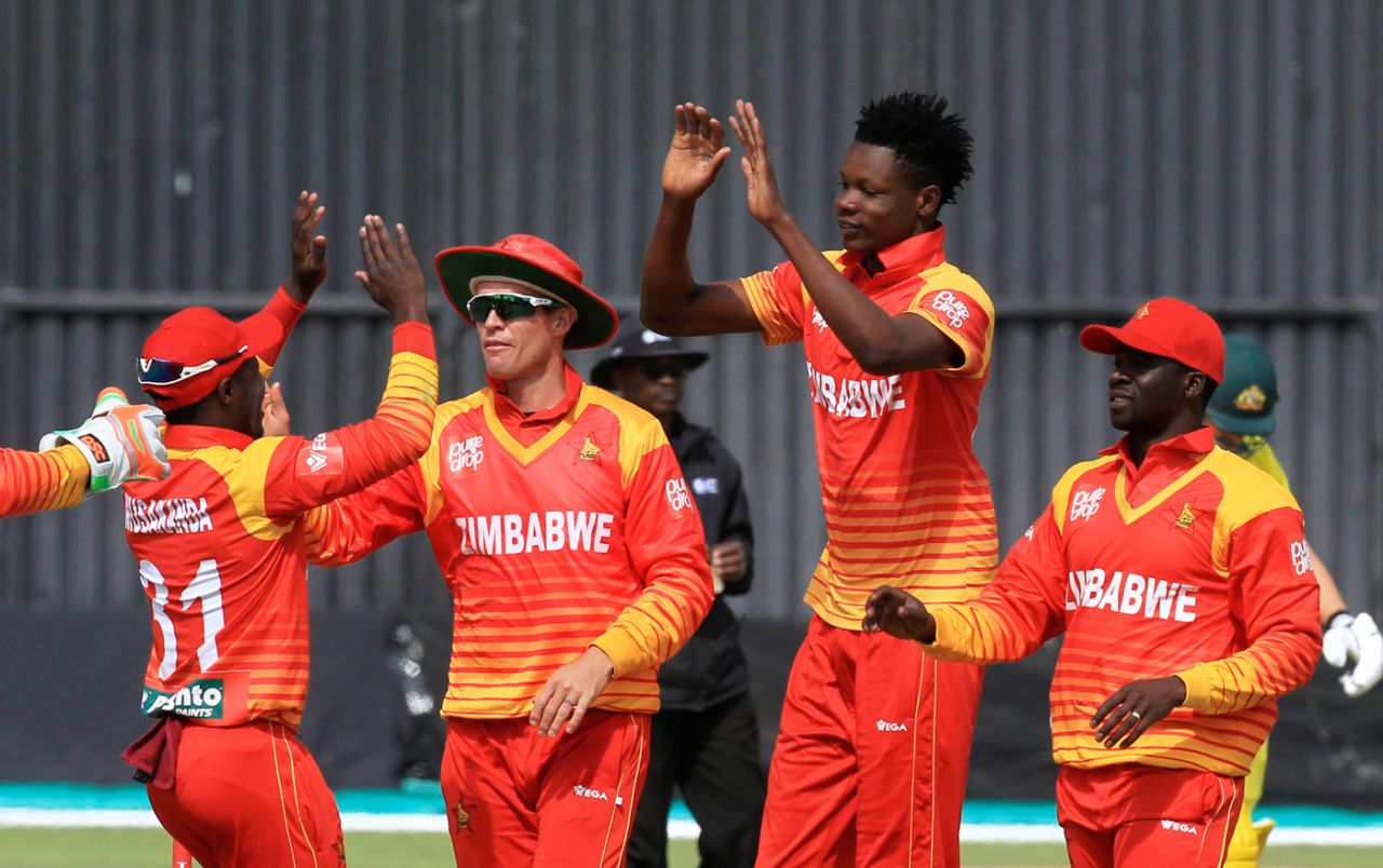 Blessing Murzarabani celebrates a wicket with his team-mates, Australia v Zimbabwe, Zimbabwe tri-series, Harare, July 6, 2018