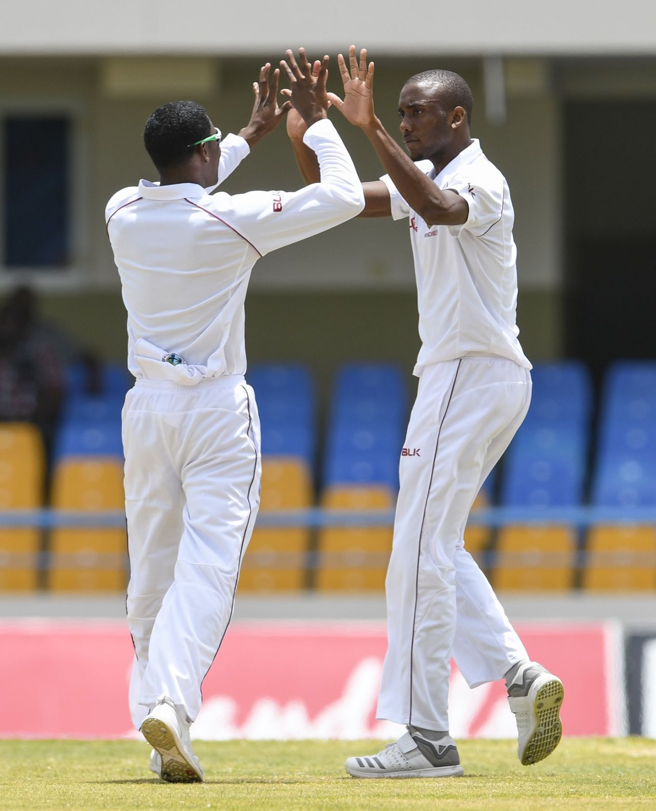 Keemo Paul celebrates with Miguel Cummins (right), West Indies v Bangladesh, 1st Test, North Sound, 2nd day, July 6, 2018
