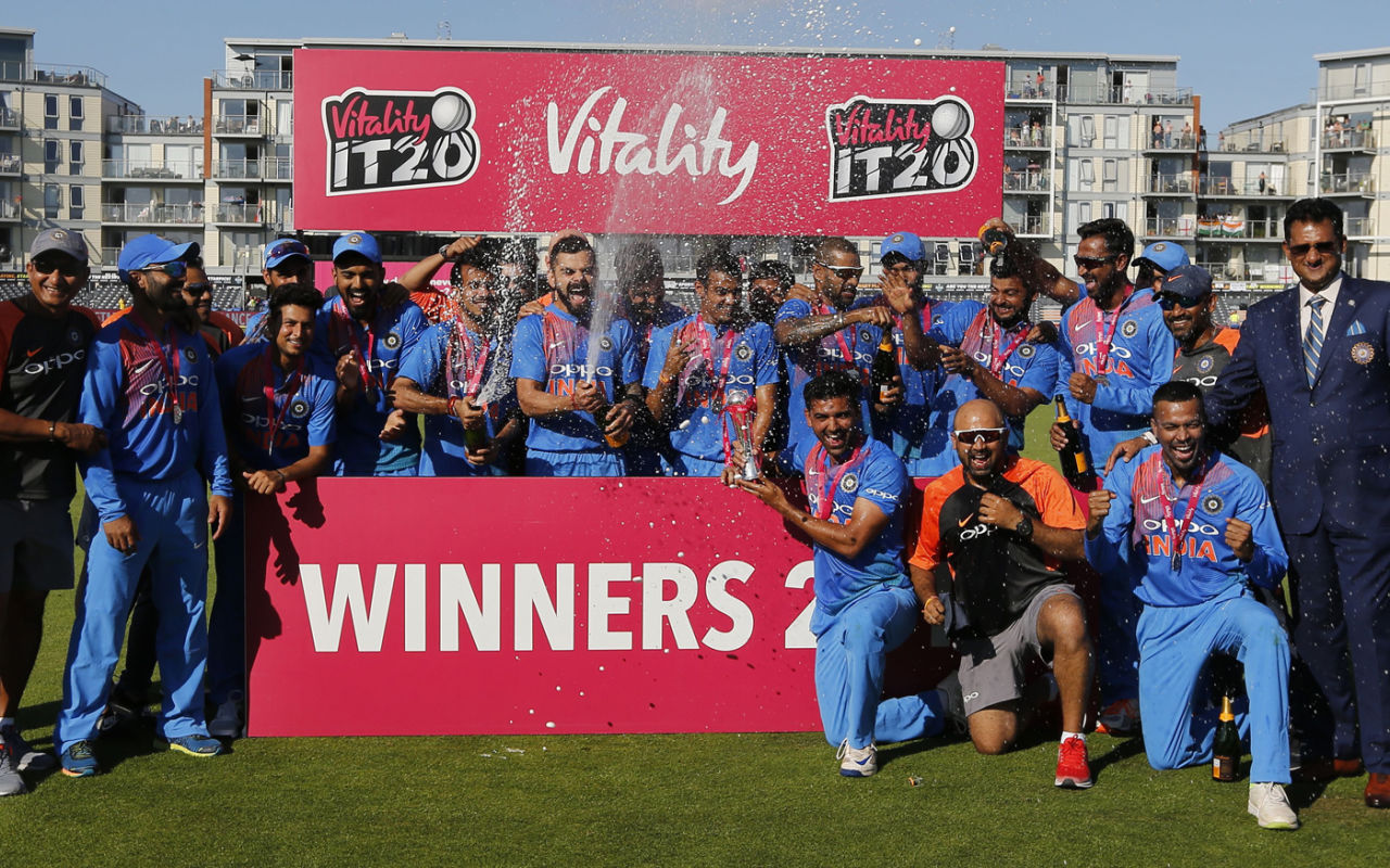 Virat Kohli and Yuzvendra Chahal uncork the champagne after the series victory, England v India, 3rd T20I, Final, Bristol, July 8, 2018