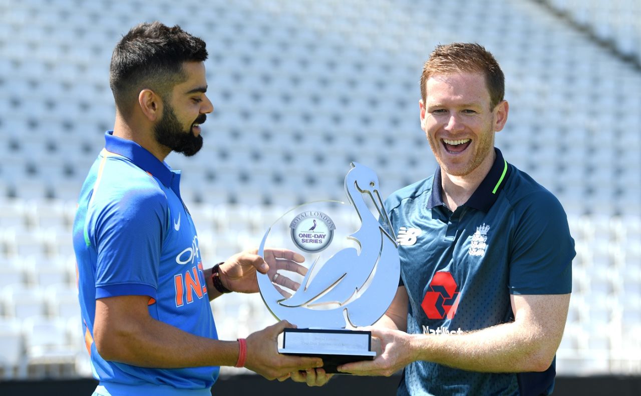 Virat Kohli and Eoin Morgan share a laugh while posing with the trophy, Nottingham, July 11, 2018