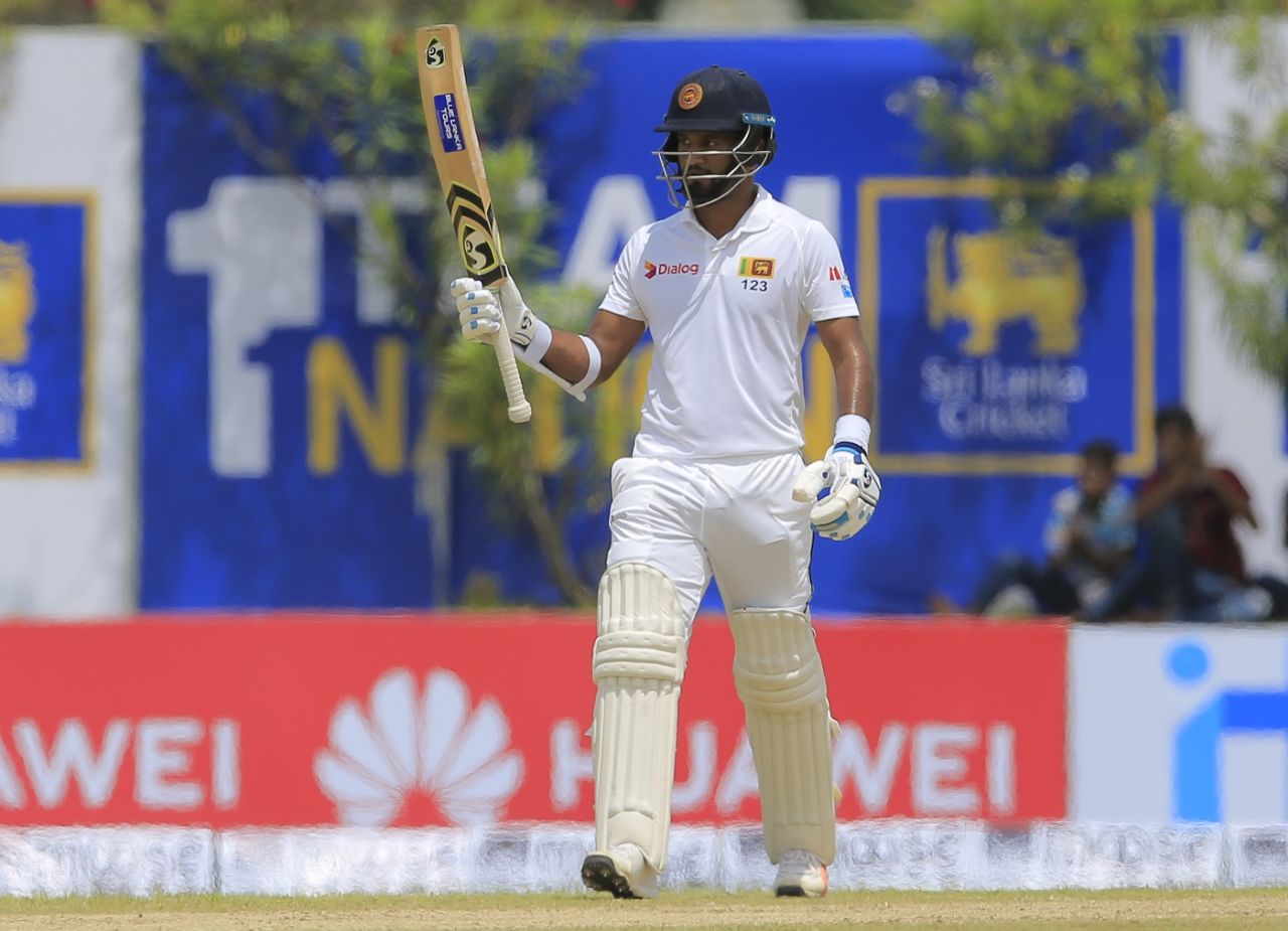 Dimuth Karunaratne raises his bat after reaching a half-century, Sri Lanka v South Africa, 1st Test, Galle, 1st day, July 12, 2018