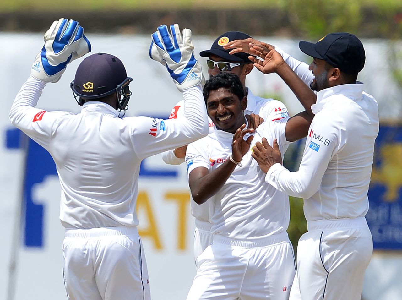 Lakshan Sandakan is mobbed by his team-mates upon picking a wicket, Sri Lanka v South Africa, 1st Test, Galle, 2nd day, July 13, 2018