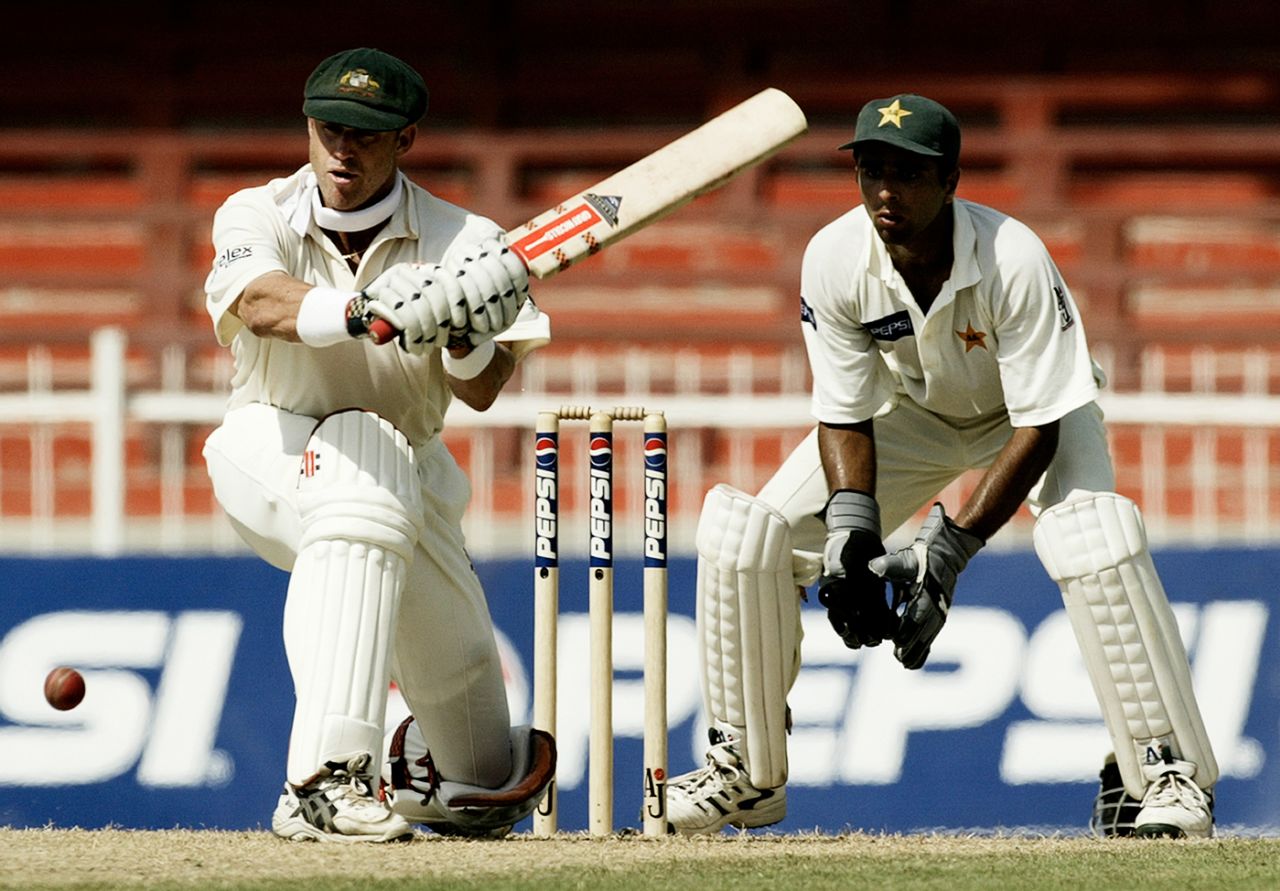 Matthew Hayden looks to sweep, Australia v Pakistan, 2nd Test, Sharjah, 2nd day, October 12, 2002