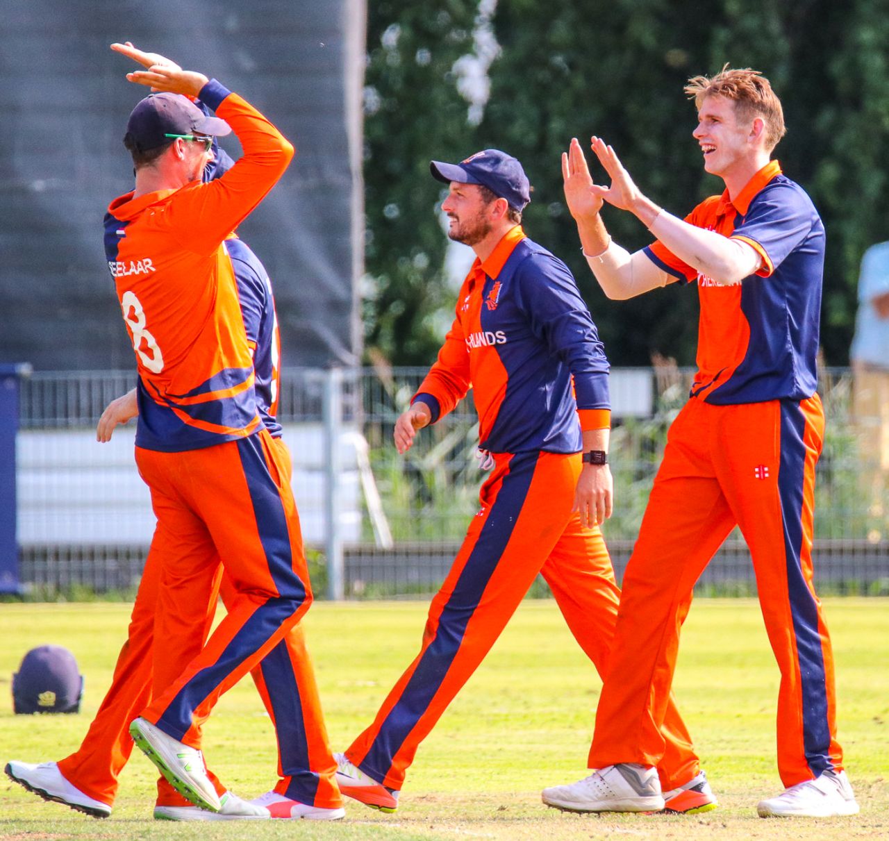 Fred Klaassen gets high-fived by captain Pieter Seelaar after taking a key wicket, Netherlands v Nepal, 1st ODI, Amstelveen, August 1, 2018
