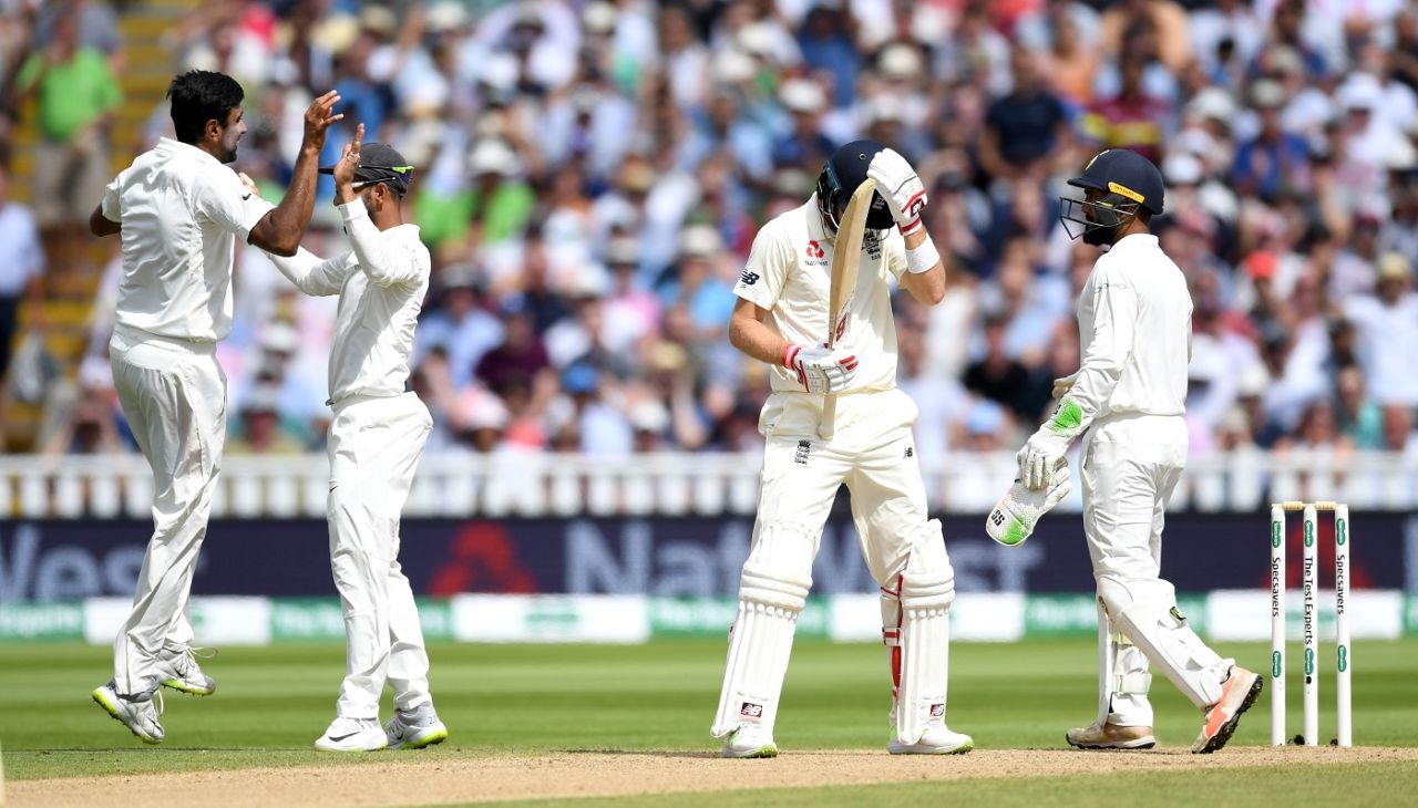 The Indians celebrate while Joe Root holds his head in agony , England v India, 1st Test, 3rd day, Edgbaston, 3 August, 2018