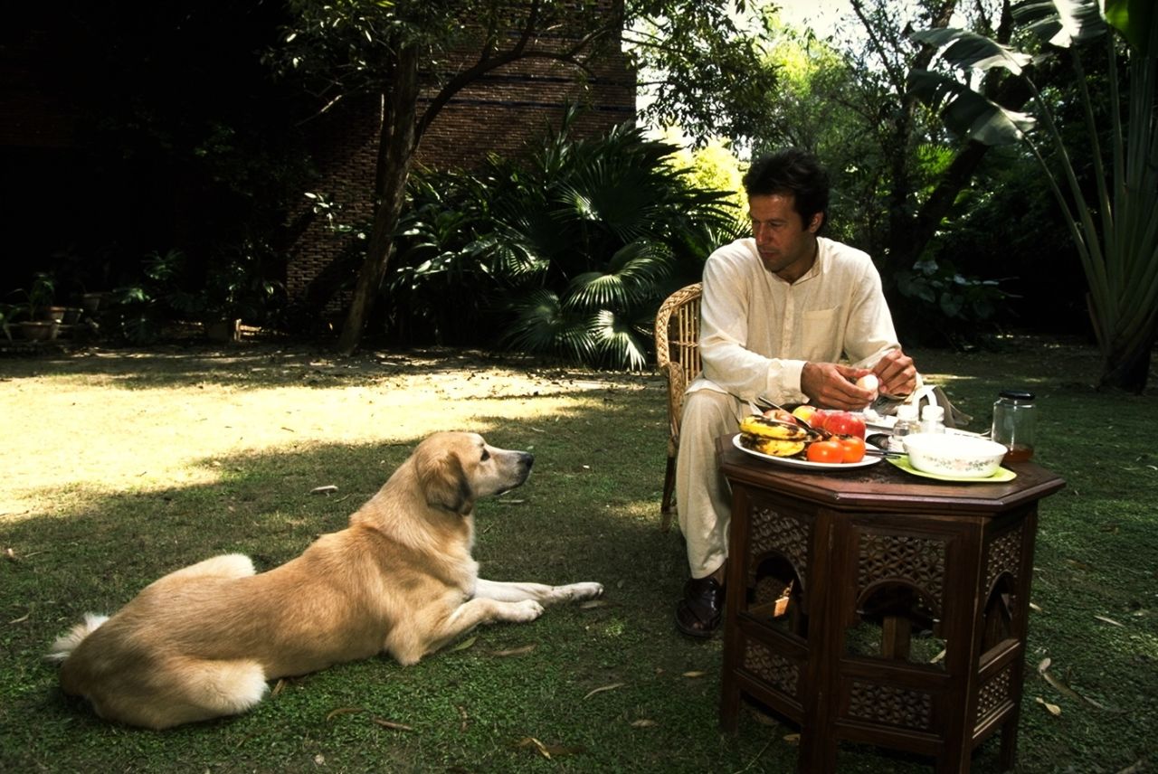 Imran Khan at breakfast with his dog, 1996