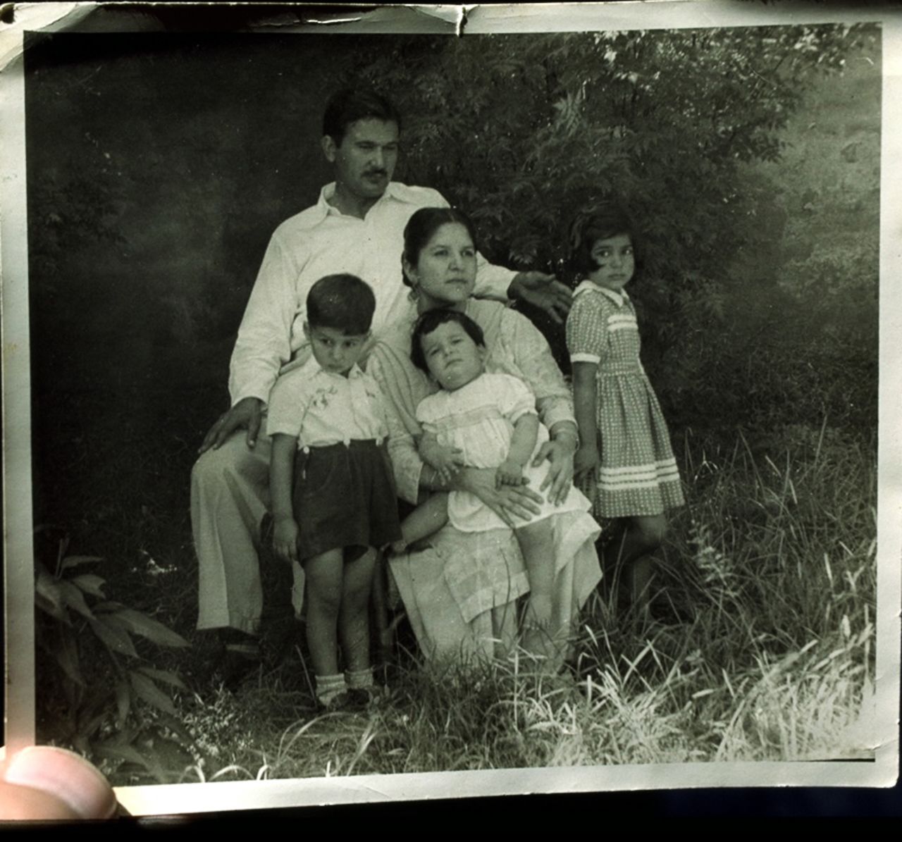 A photograph of Imran Khan as a child with his parents and sisters