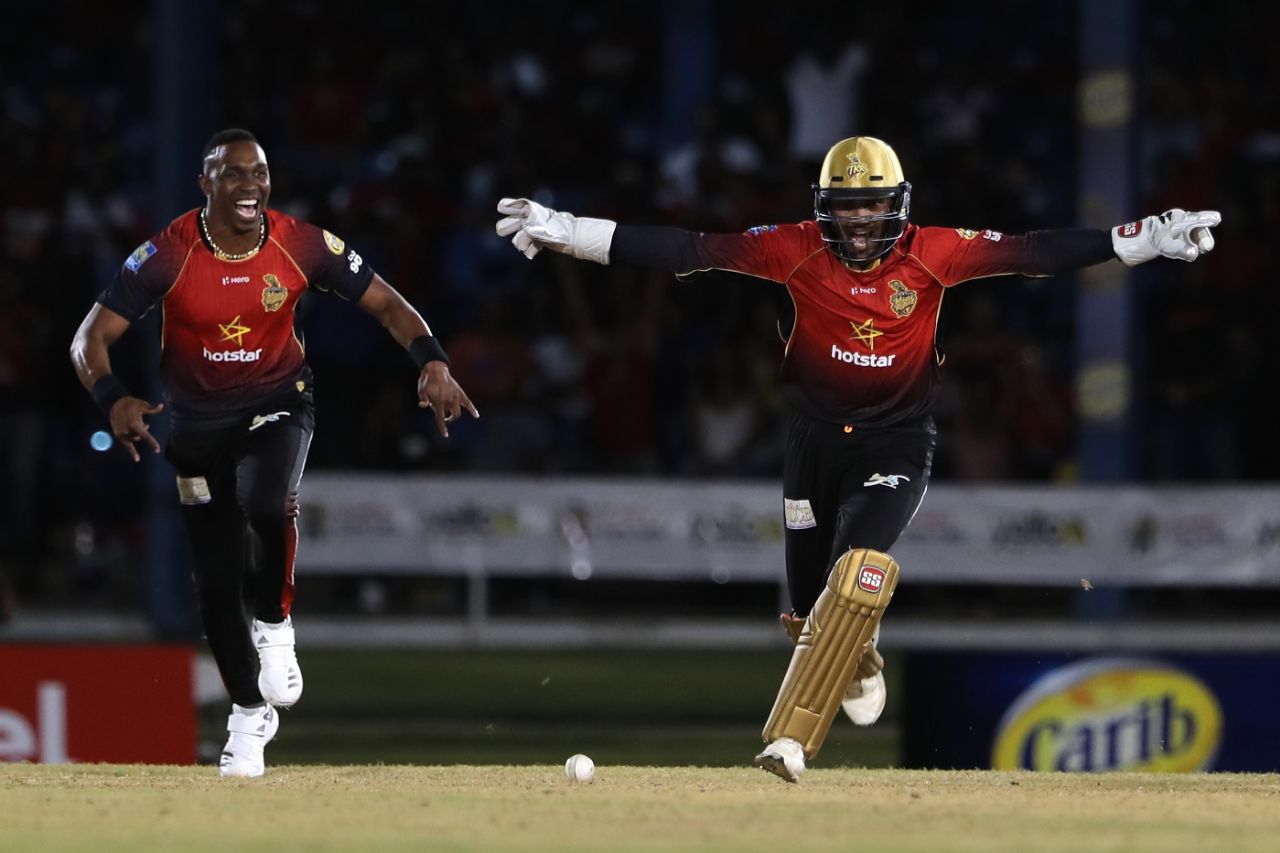 Dwayne Bravo and Denesh Ramdin celebrate a wicket, Trinbago Knight Riders v St Lucia Stars, CPL 2018, Port of Spain, August 8, 2018