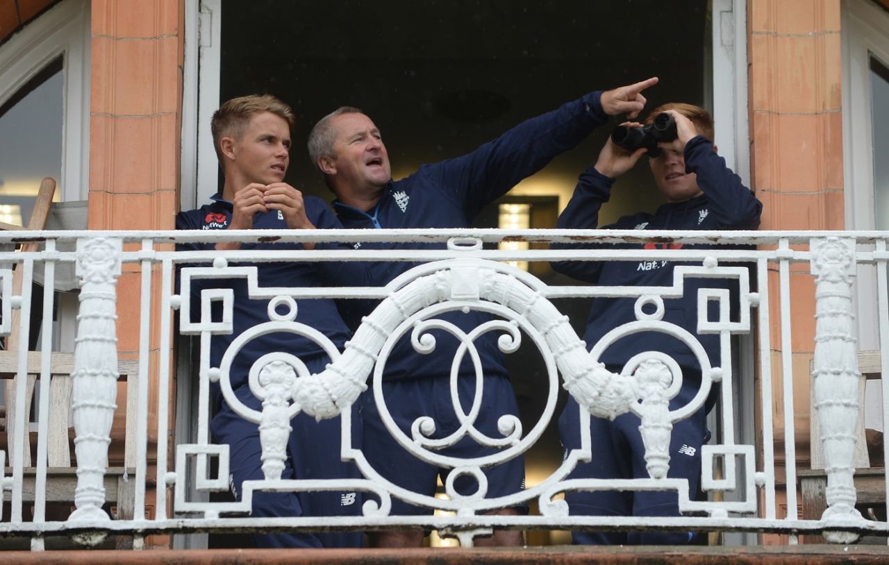 Sam Curran, Paul Farbrace and Ollie Pope wait for the rain to cease at the Lord's balcony, England v India, 2nd Test, Lord's, 1st day, August 9, 2018