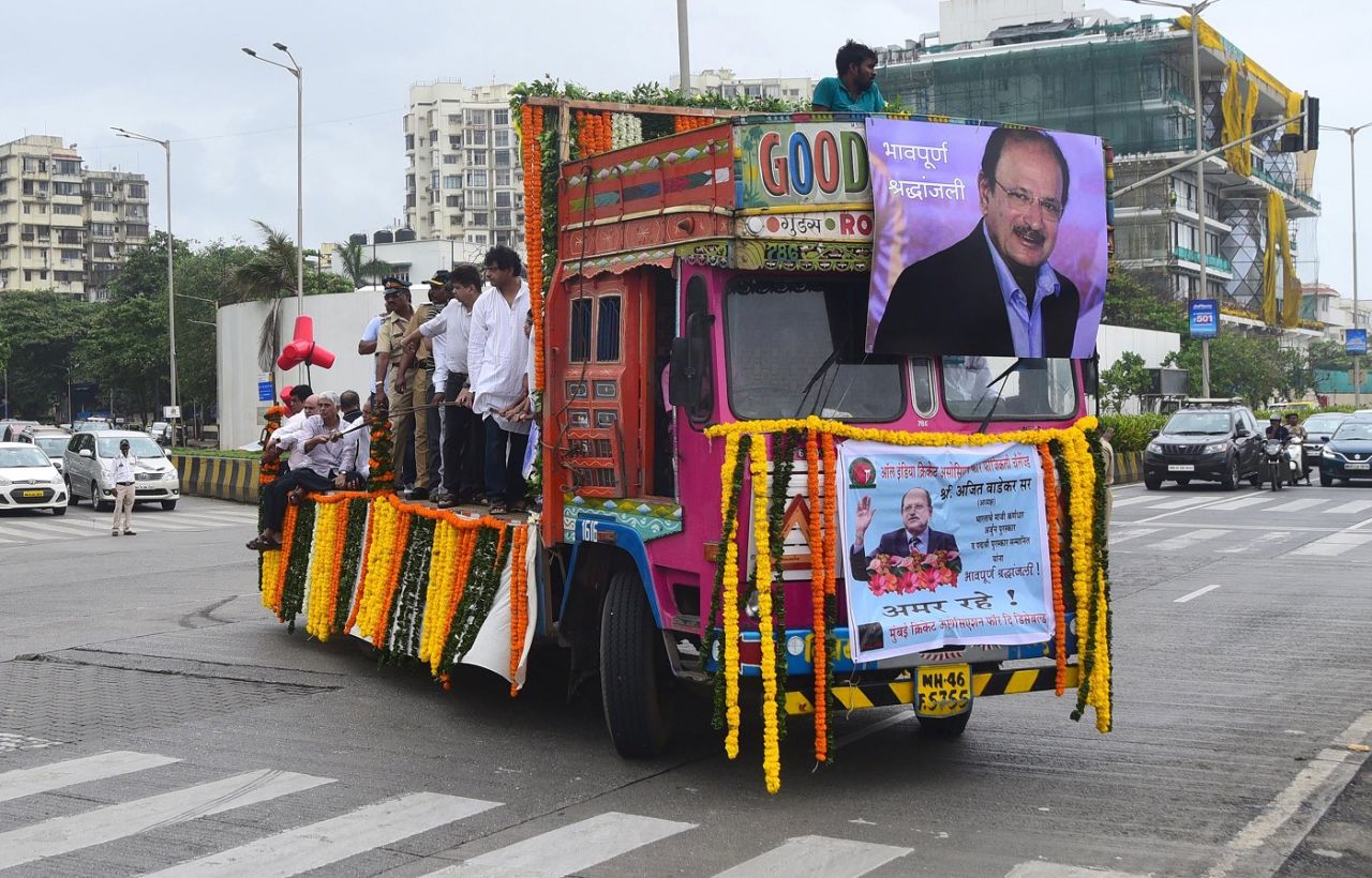 A truck carrying the body of Ajit Wadekar makes its way to a crematorium in Mumbai, August 17, 2018