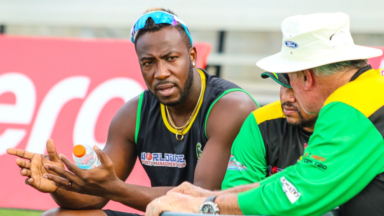 Jamaica Tallawahs captain Andre Russell chats with coaches Mark O'Donnell and Ramnaresh Sarwan during training, Lauderhill, August 17, 2018
