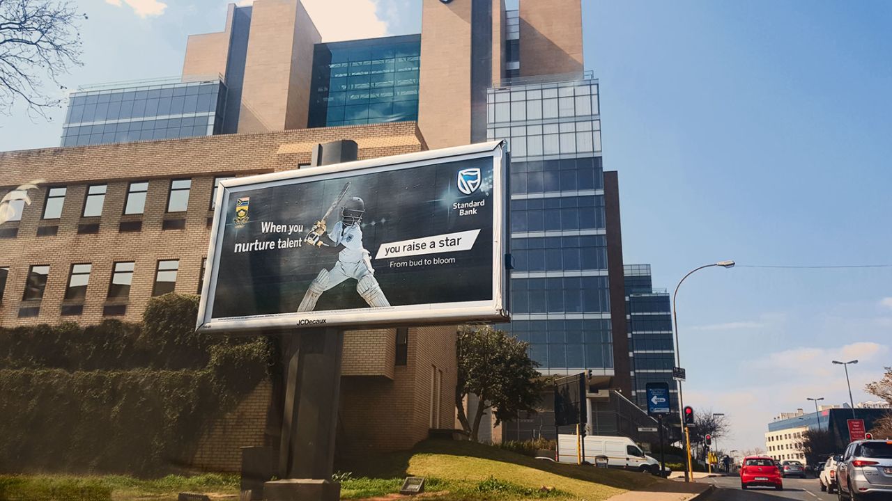 A billboard featuring a young black cricketer in Johannesburg