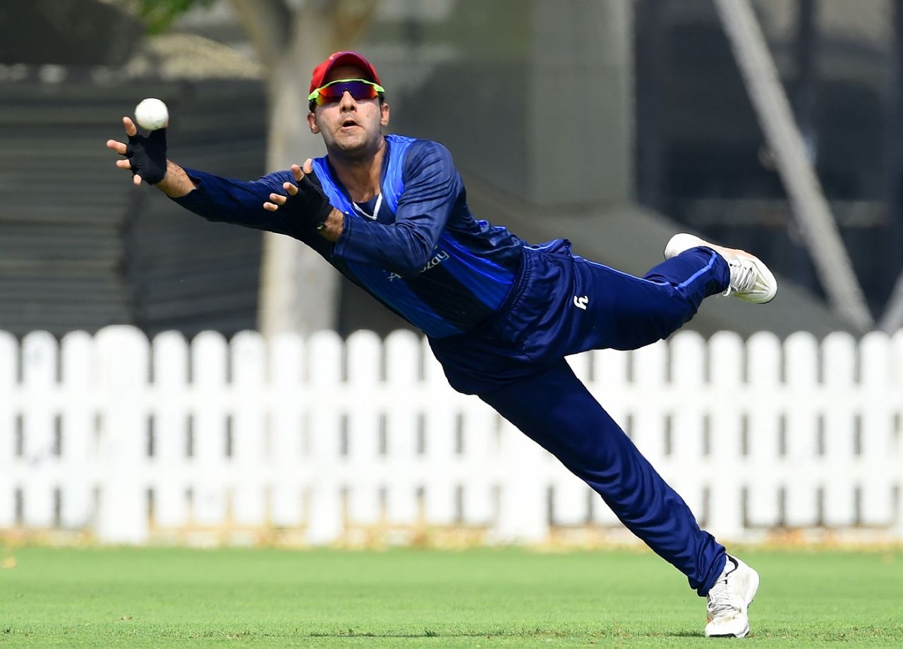 Hashmatullah Shahidi takes off after a catch, Dubai, September 14, 2018