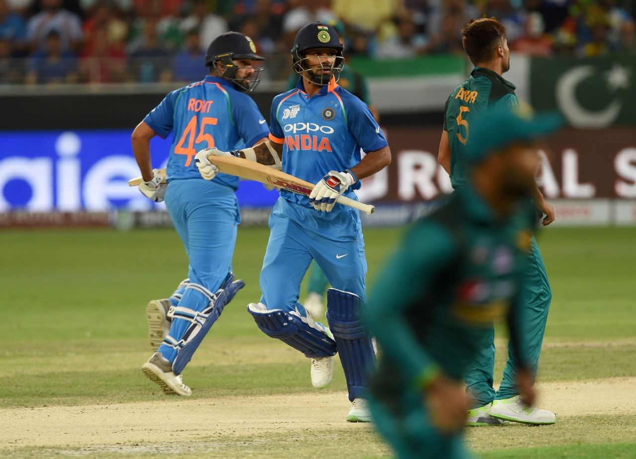 Shikhar Dhawan and Rohit Sharma amble across for a run, India v Pakistan, Super Fours, Asia Cup 2018, Dubai, September 23, 2018