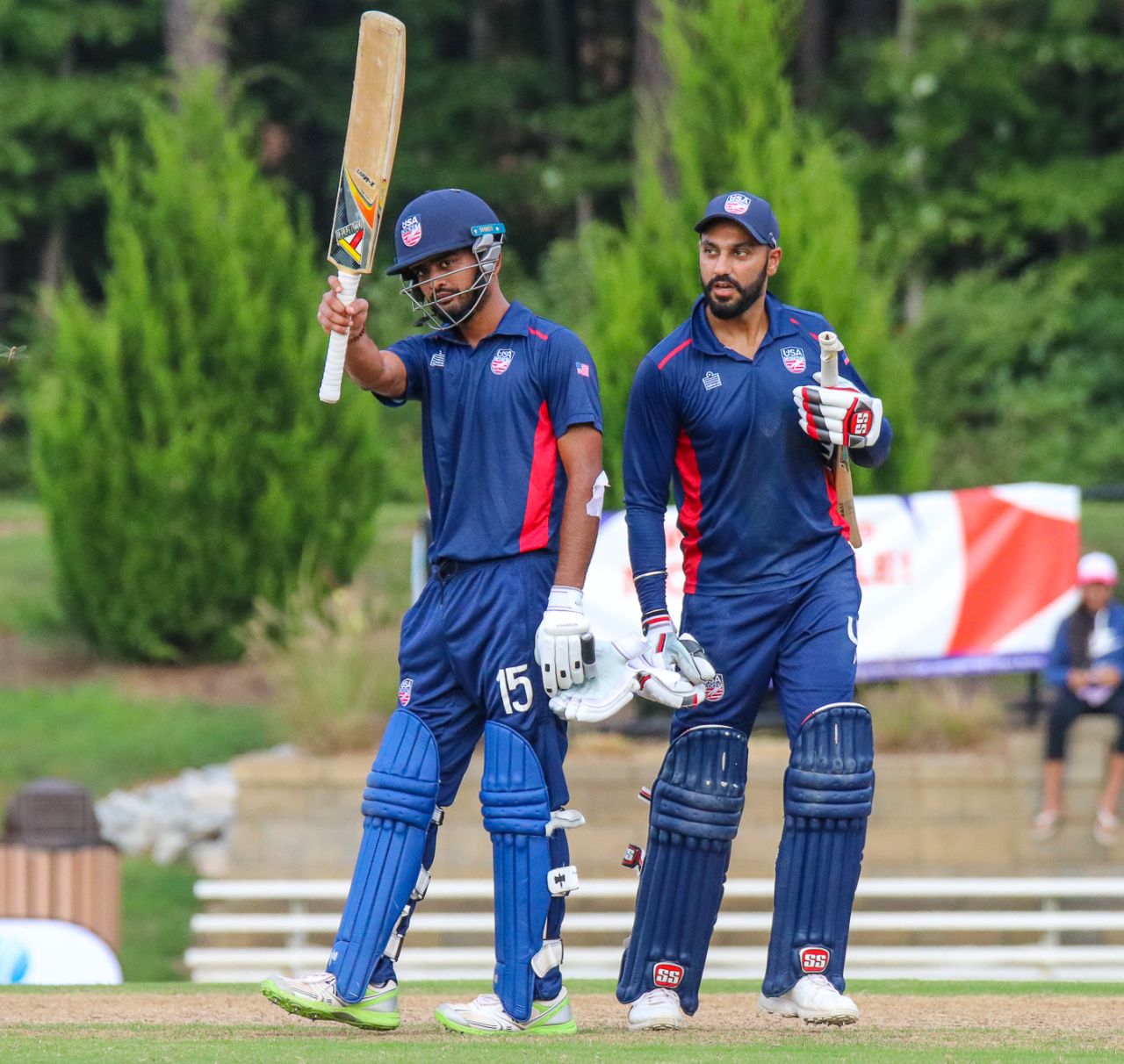 Monank Patel raises his bat after reaching his maiden T20 century for USA off 55 balls, USA v Belize, ICC World Twenty20 Americas Sub Regional Qualifier A, Morrisville, September 21, 2018