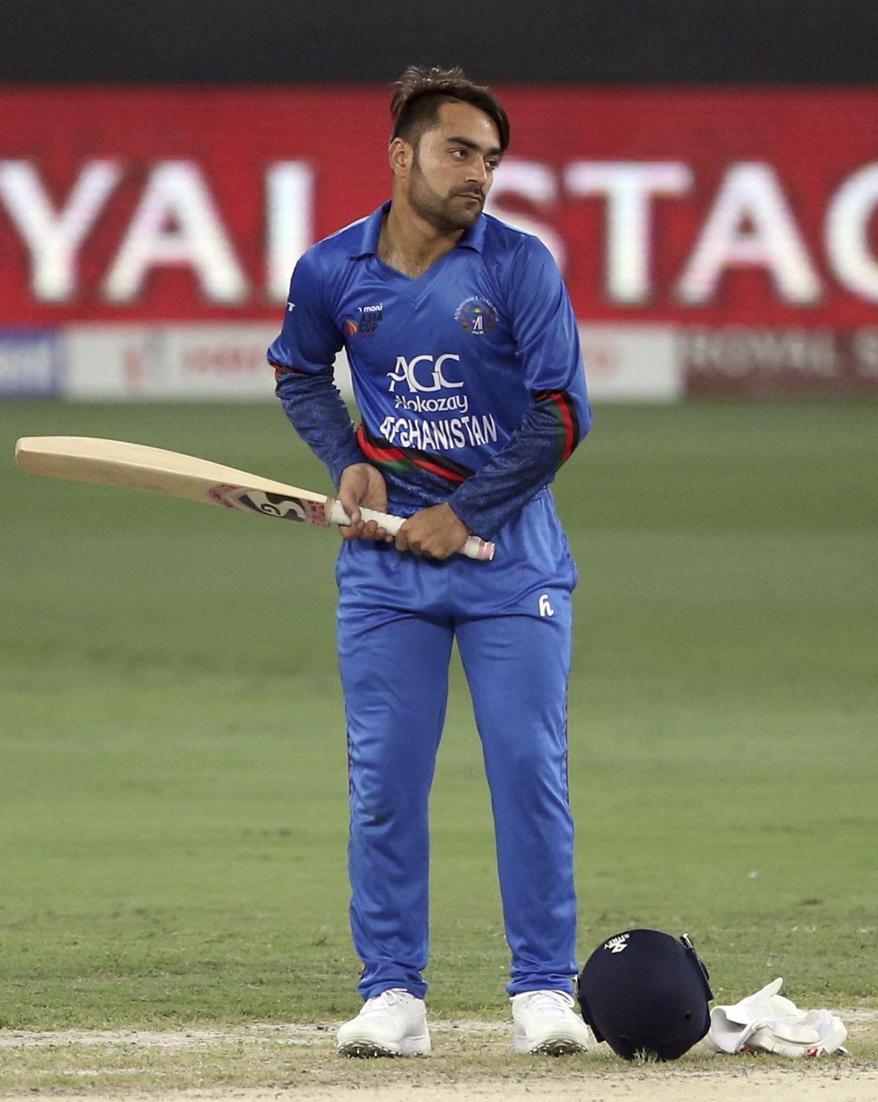 Rashid Khan fiddles around with KL Rahul's bat during the drinks break, Afghanistan v India, Asia Cup 2018, Dubai, September 25, 2018