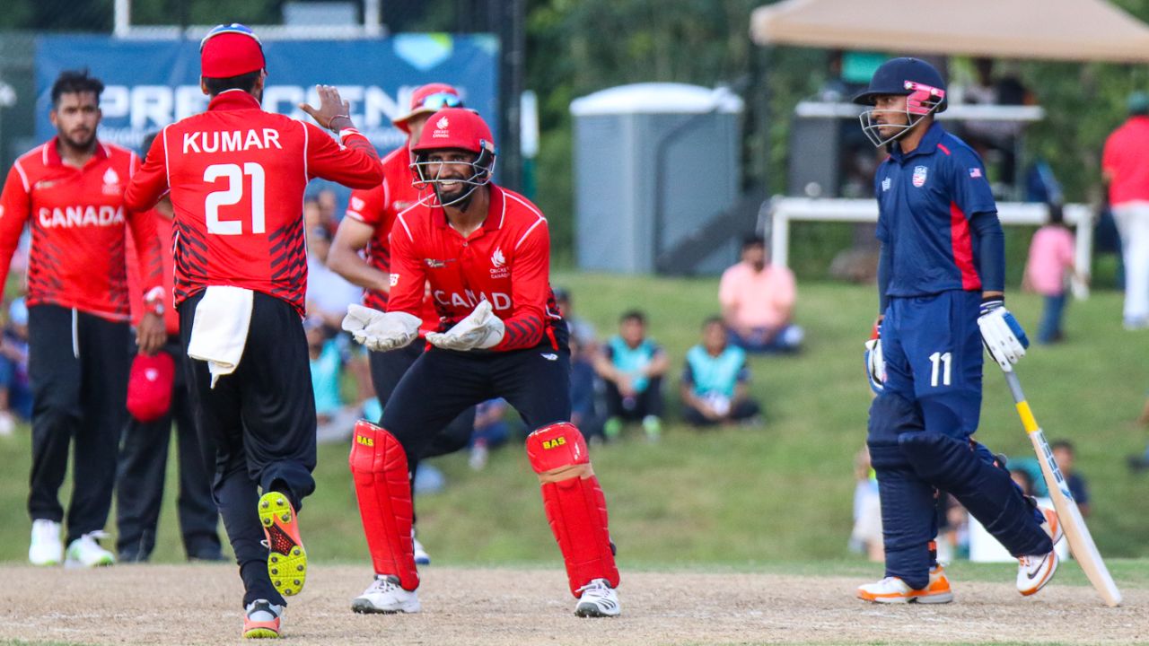 Nitish Kumar runs in to high five Hamza Tariq after teaming up to run out Timil Patel, USA v Canada, ICC World Twenty20 Americas Sub Regional Qualifier A, Morrisville, September 22, 2018