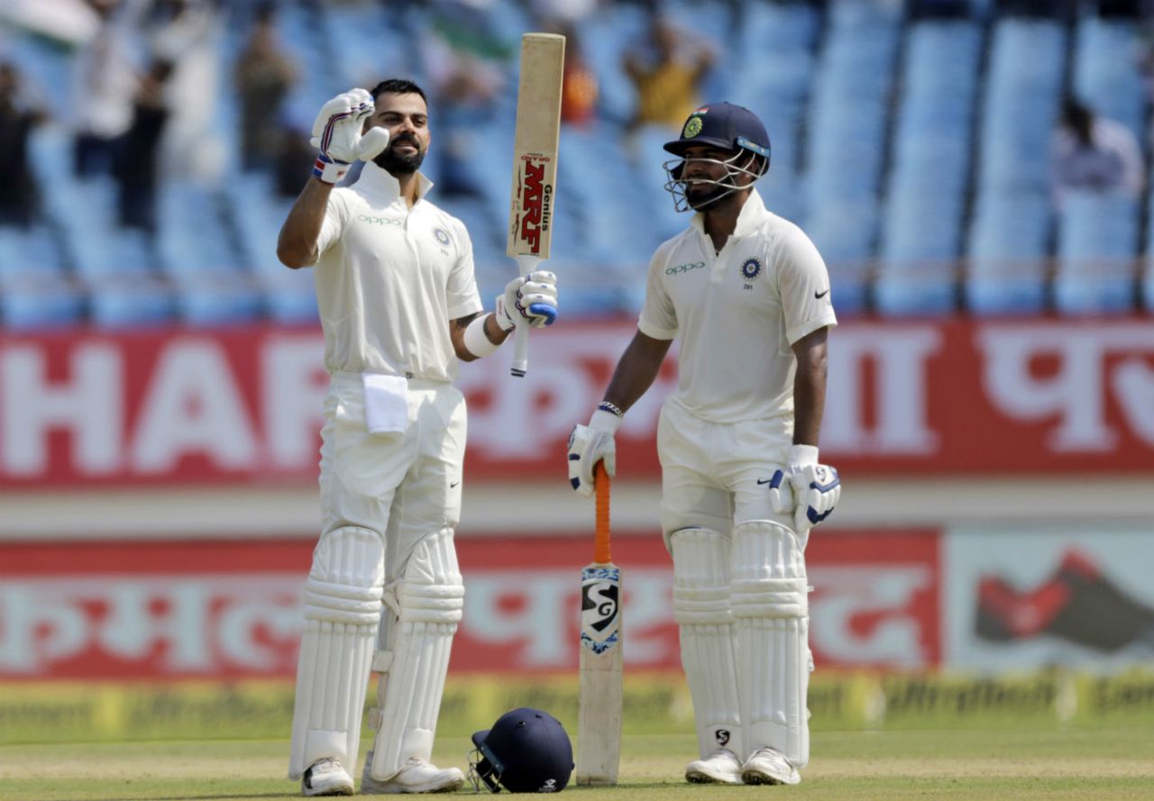 Virat Kohli soaks in the applause after bringing up his 24th Test ton even as Rishabh Pant watches, India v West Indies, 1st Test, Rajkot, 2nd day, October 5, 2018