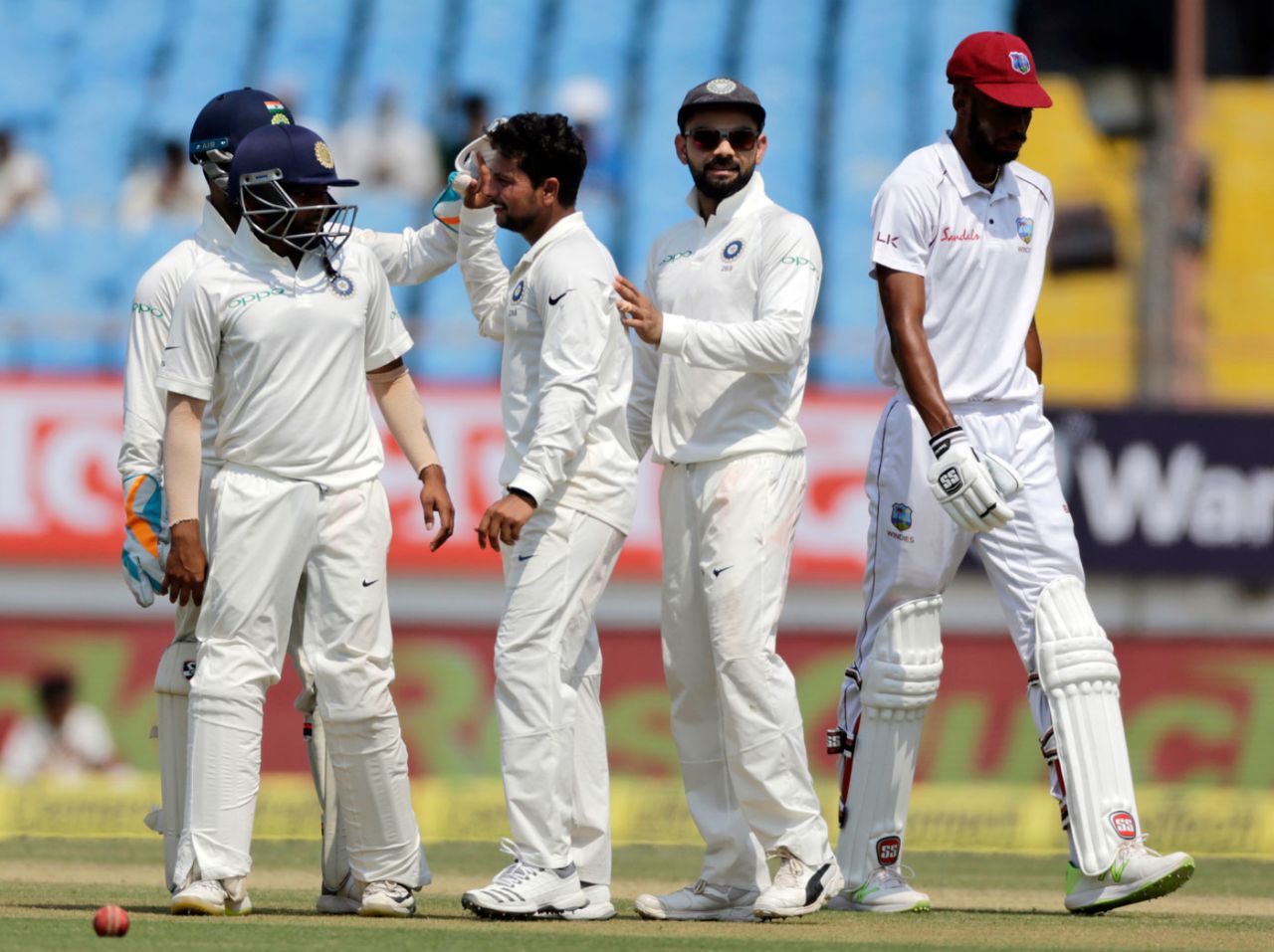 Kuldeep Yadav celebrates with his team-mates, 1st Test, Rajkot, 3rd day, October 6, 2018