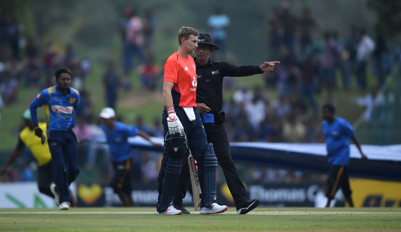 Joe Root heads off as the covers come on, Sri Lanka v England, 1st ODI, Dambulla, October 10, 2018