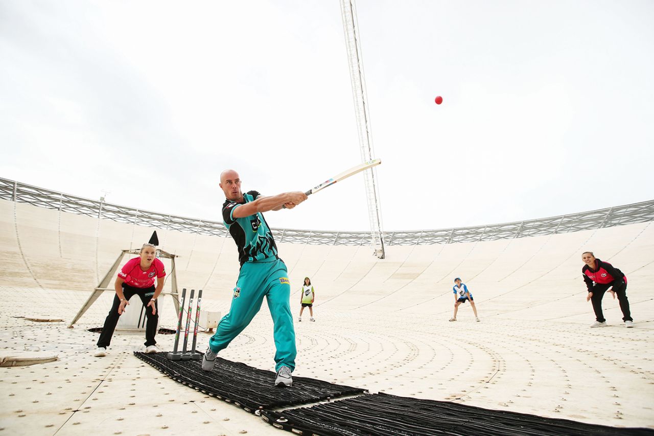 Chris Lynn hits out on the radio telescope in Parkes, NSW, re-enacting a scene from the movie <i>The Dish</i>, which told the story of how the telescope transmitted the first TV pictures from the 1969 Apollo 11 moon landing, Australia, October 11, 2019