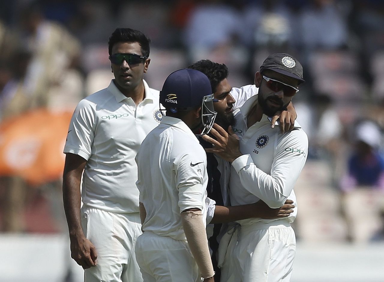 A fan hugs Virat Kohli on the field, India v West Indies, 2nd Test, Hyderabad, 1st day, October 12, 2018