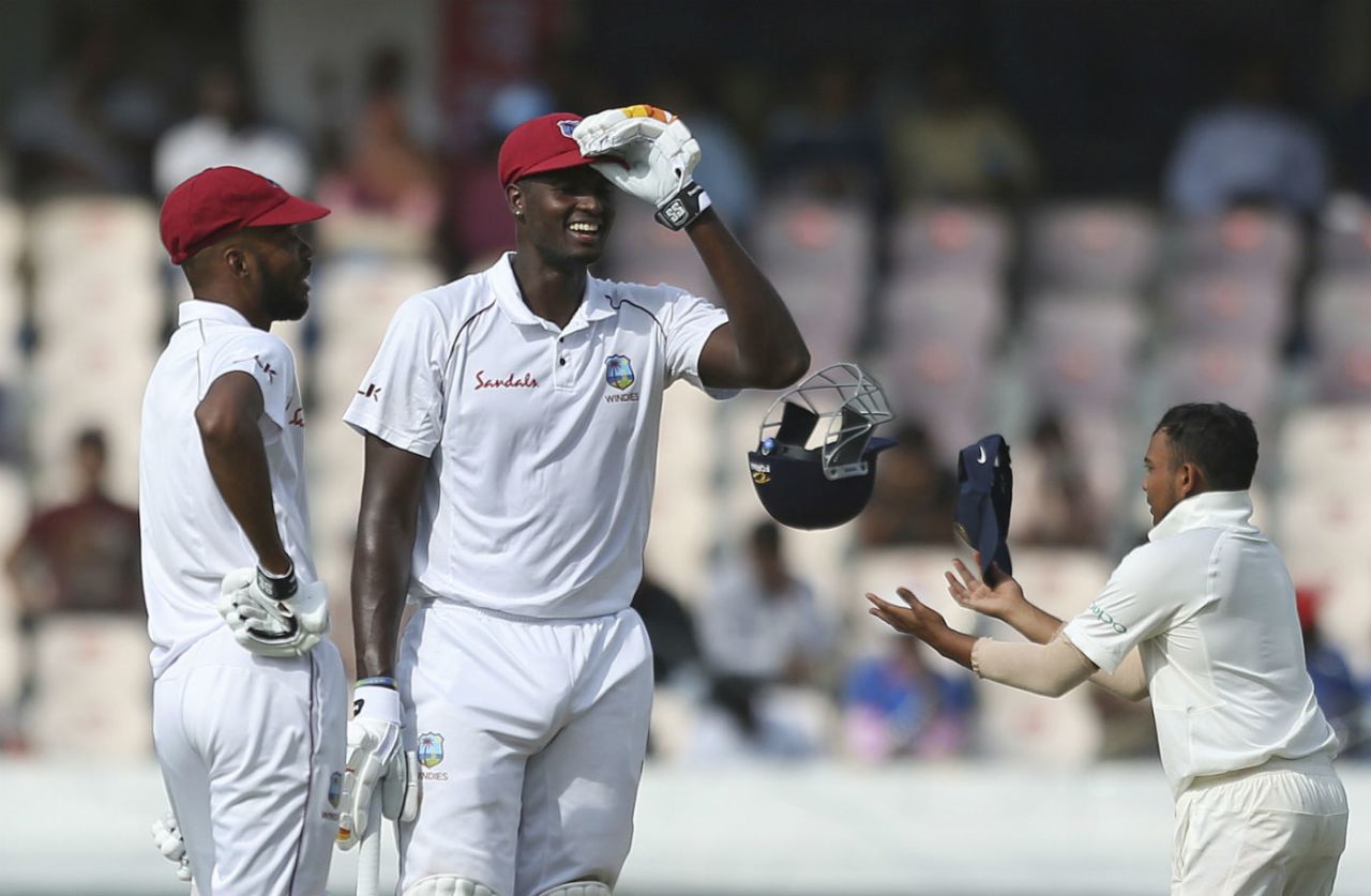 Jason Holder shares a laugh with Roston Chase, India v West Indies, 2nd Test, Hyderabad, 1st day, October 12, 2018