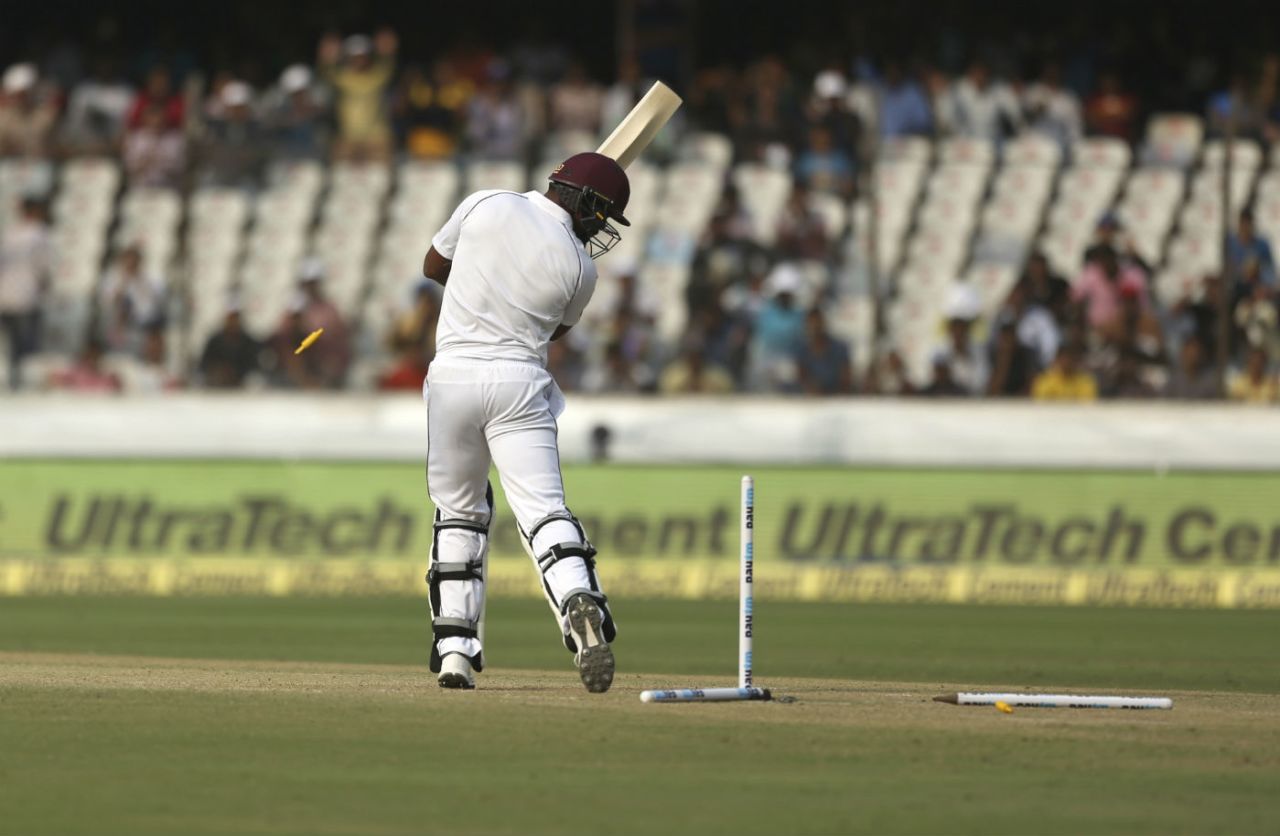 Shannon Gabriel watches the off and leg stump flattened by Umesh Yadav's thunderbolt, India v West Indies, 2nd Test, Hyderabad, 3rd day, October 14, 2018