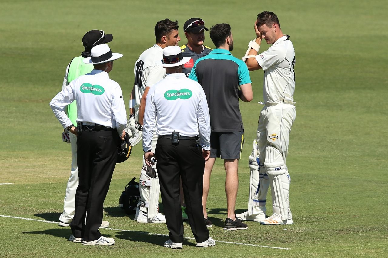 Matthew Kelly is checked on by medical staff after being struck on the helmet by a Chris Tremain bouncer, Western Australia v Victoria, Sheffield Shield, Perth, October 16, 2018
