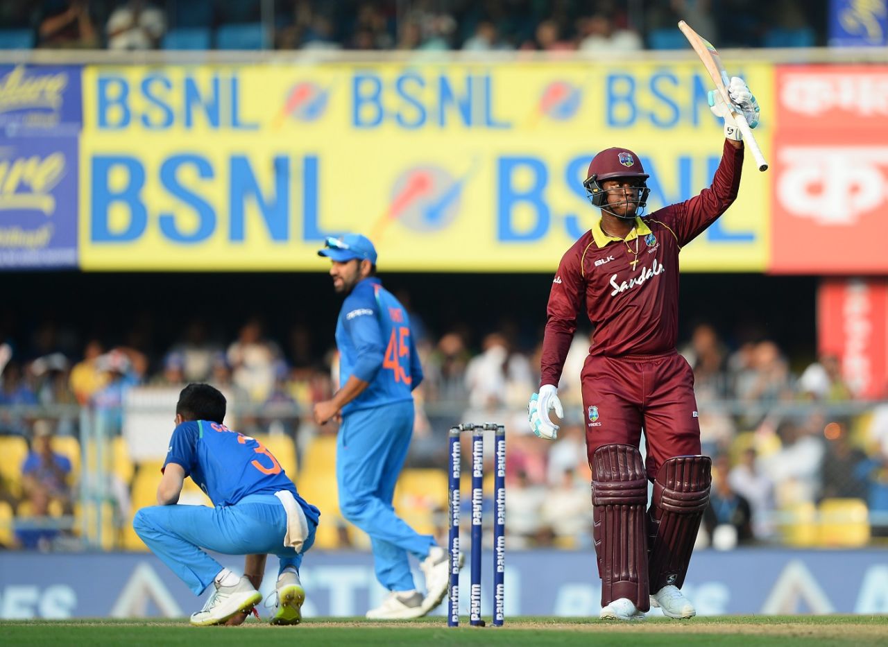 Shimron Hetmyer raises his bat after getting to fifty, India v West Indies, 1st ODI, Guwahati, October 21, 2018