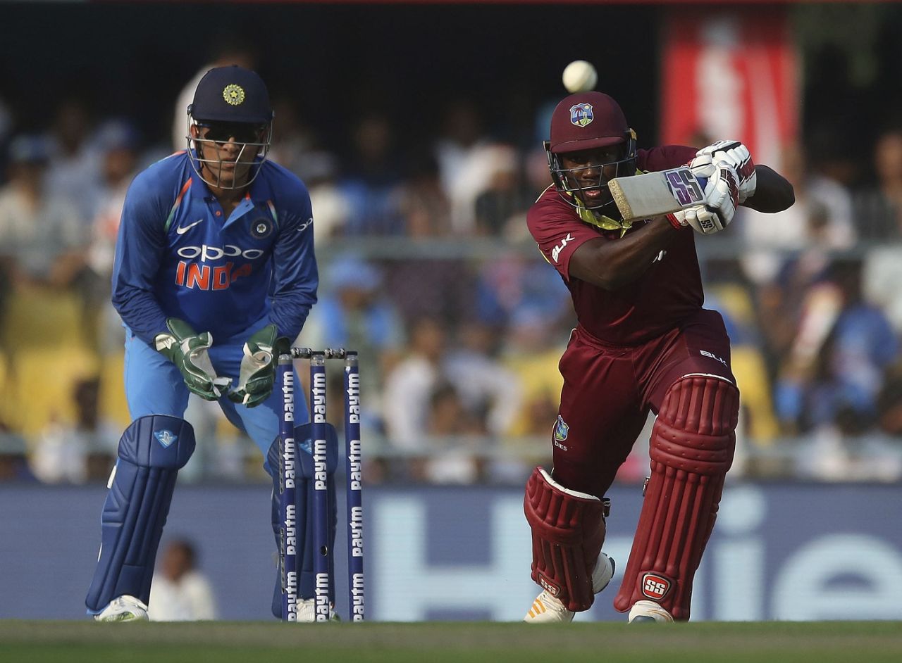 MS Dhoni looks on as Rovman Powell drives down the ground, India v West Indies, 1st ODI, Guwahati, October 21, 2018