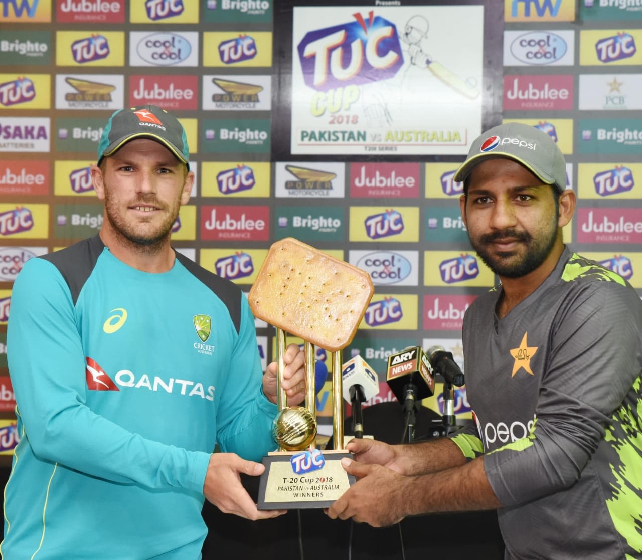 Taking the biscuit: Aaron Finch and Sarfraz Ahmed pose with the T20I series trophy, Abu Dhabi, October 23, 2018