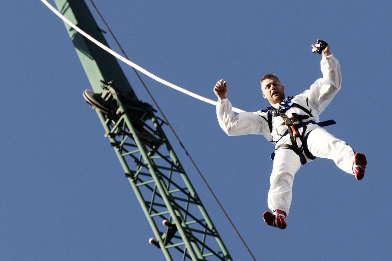Andrew Flintoff hangs from a crane during an attempt to reverse-bungee, London, March 19, 2012