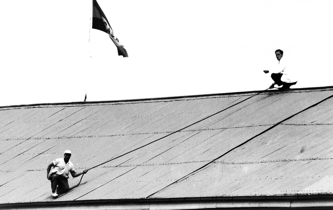Groundsmen at the Adelaide Oval use a rope to retrieve the ball from the roof after Ted Dexter placed it there with a big six, South Australia v MCC, Adelaide, December 27, 1962
