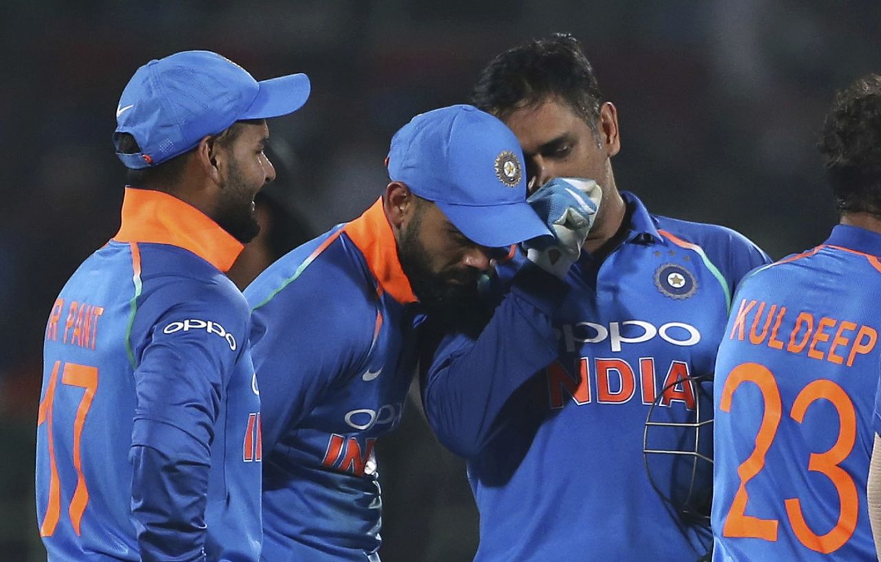 MS Dhoni has some tactics to discuss with Virat Kohli while Rishabh Pant looks on, India v West Indies, 2nd ODI, Visakhapatnam, October 24, 2018