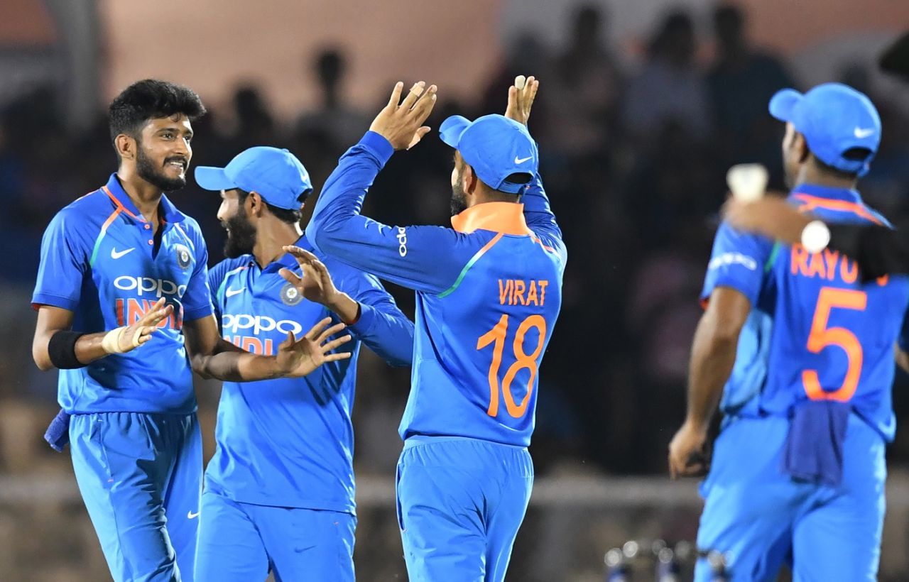 Virat Kohli and Khaleel Ahmed celebrate a wicket with teammates, India v West Indies, 4th ODI, CCI Mumbai, October 29, 2018