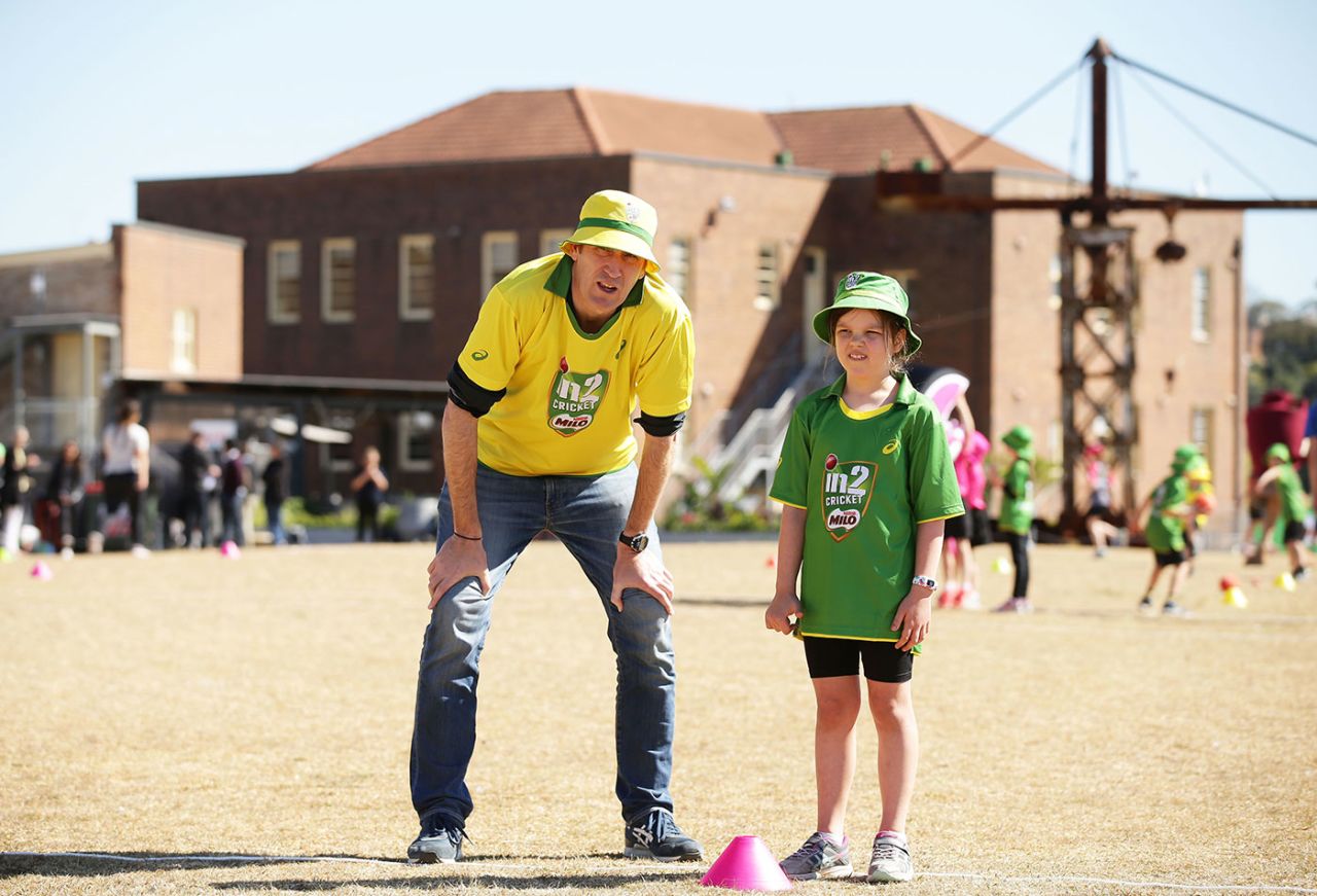 Cricket Australia CEO James Sutherland helps out during a coaching session for kids, Sydney, September 15, 2017